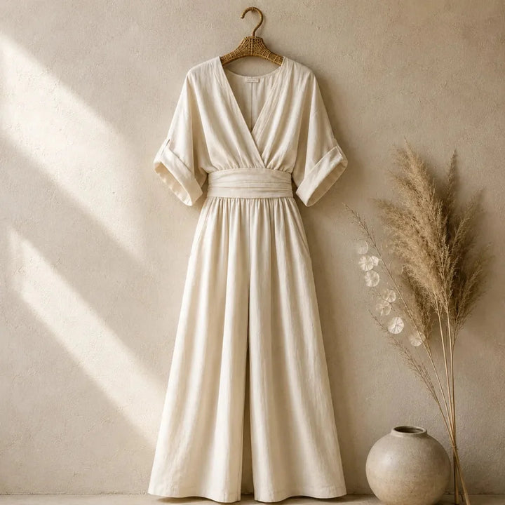 Soléra – Wide Leg V Neck Jumpsuit with Pleated Waist Sash